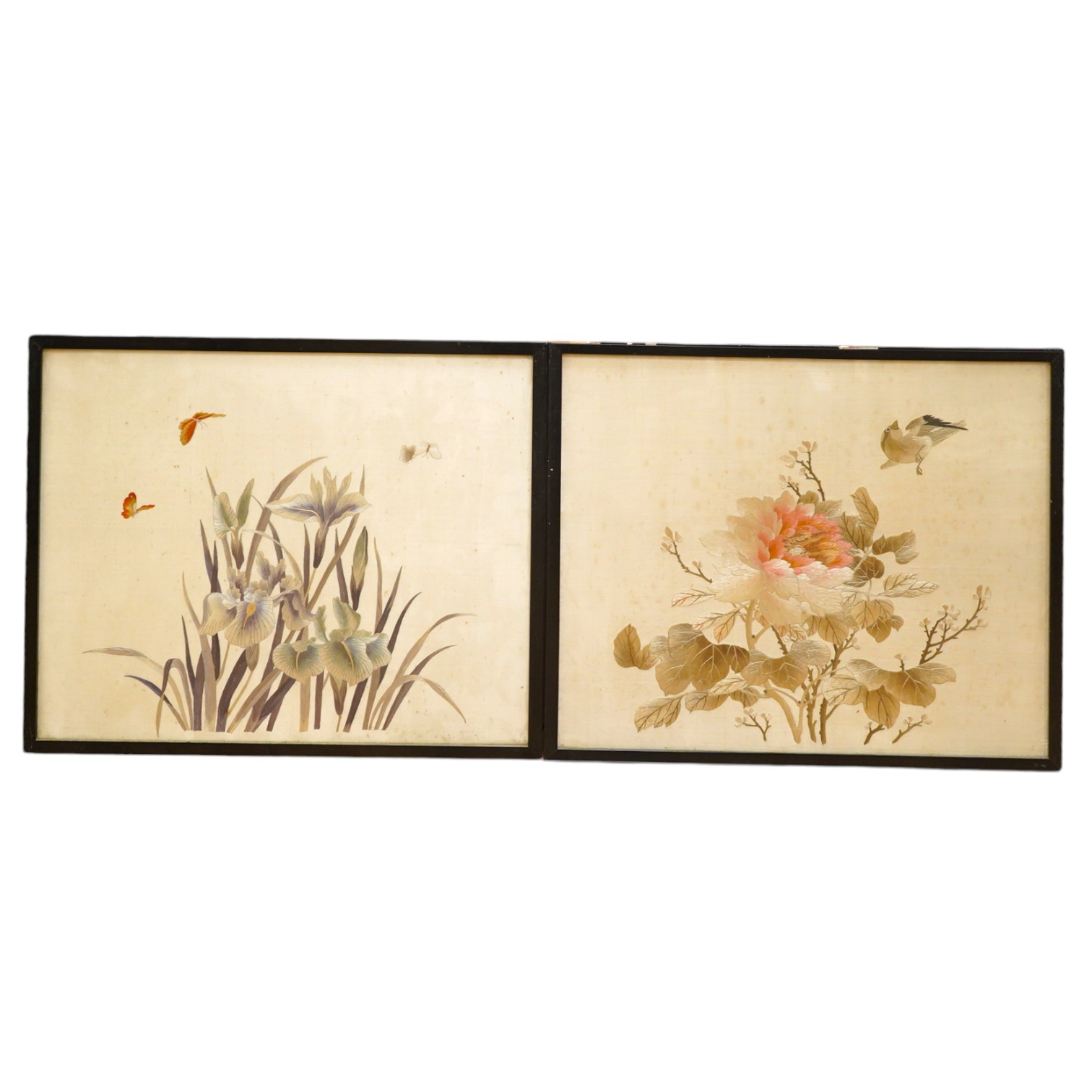 Two early 20th century Japanese cream silk polychromes embroidered panels of flowers birds and butterflies, largest 45cm wide x 37cm high. Condition - there are marks on the cream silk, which may be able to be profession